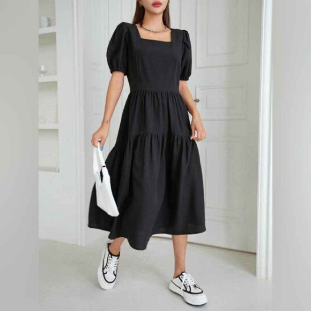 Black tiered dress with puff sleeves